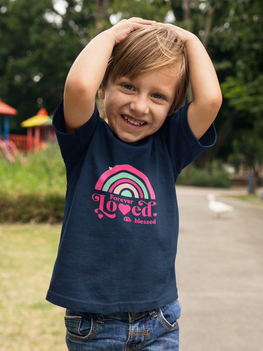 CIASARA cute rainbow toddler t-shirt navy blue with colorful rainbow graphic and text worn by smiling child