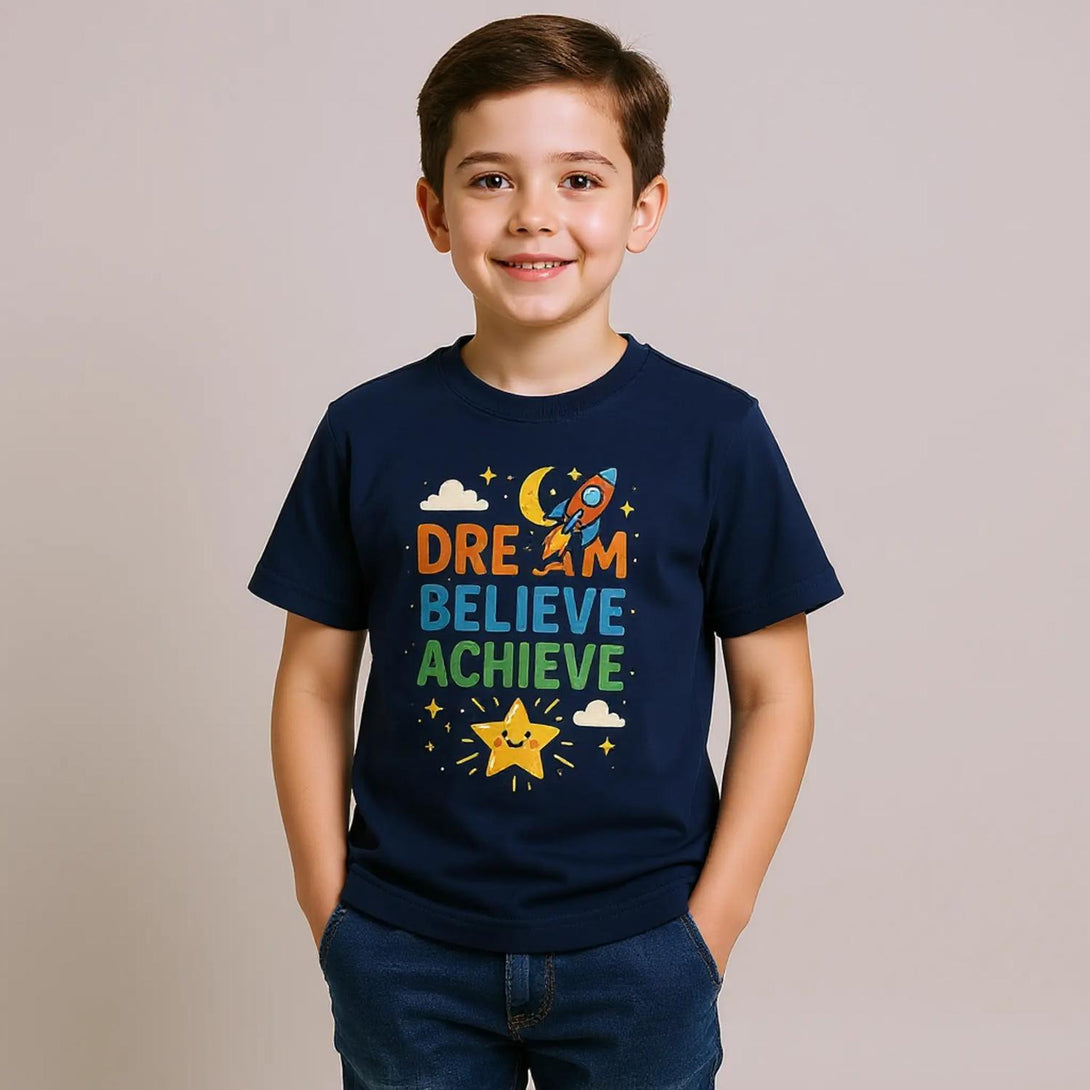 CIASARA cute inspirational kids tee navy blue with rocket Dream Believe Achieve graphic on smiling boy